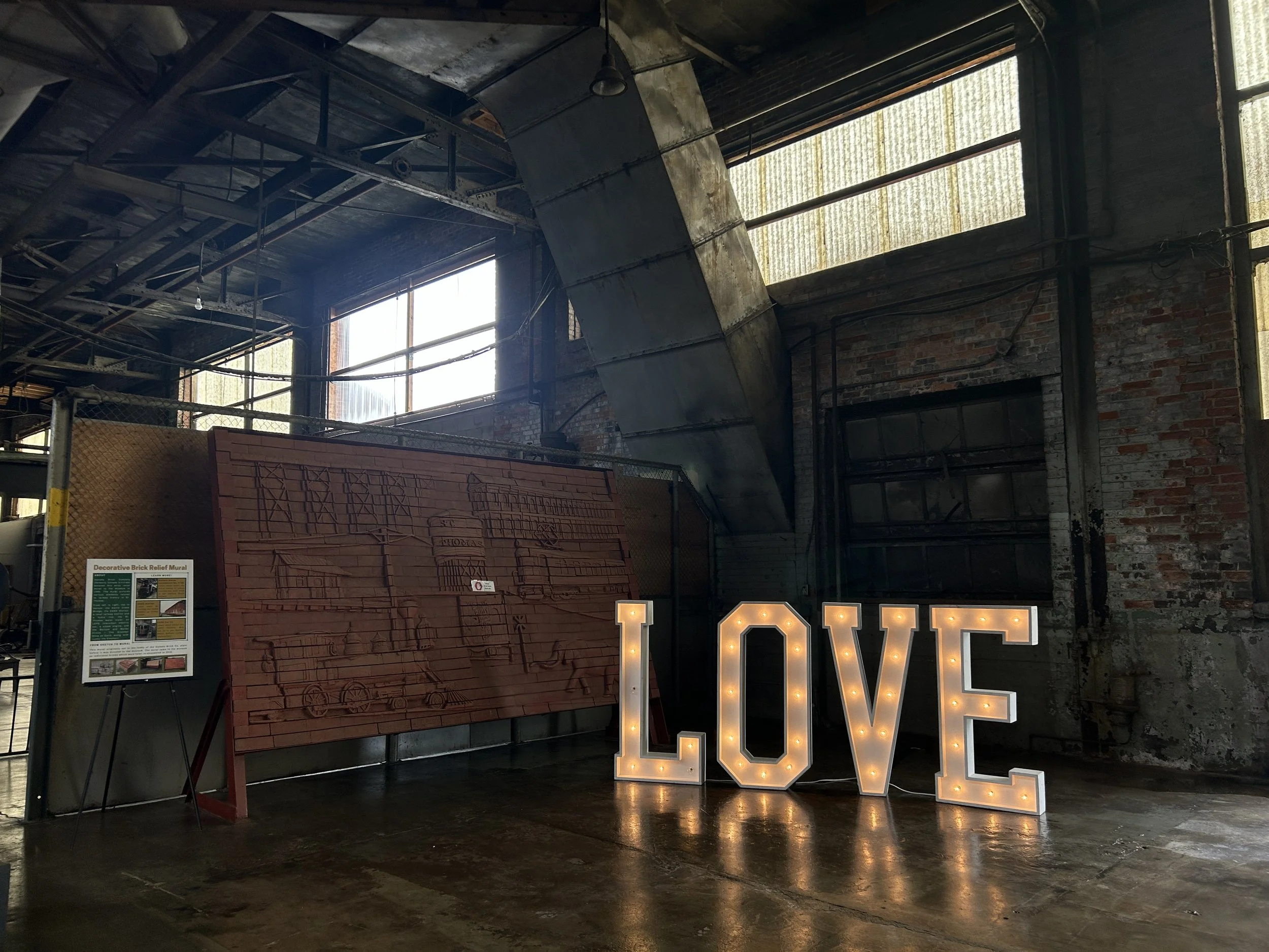 Photo of wedding decorations inside the museum with letters spelling “LOVE” on display
