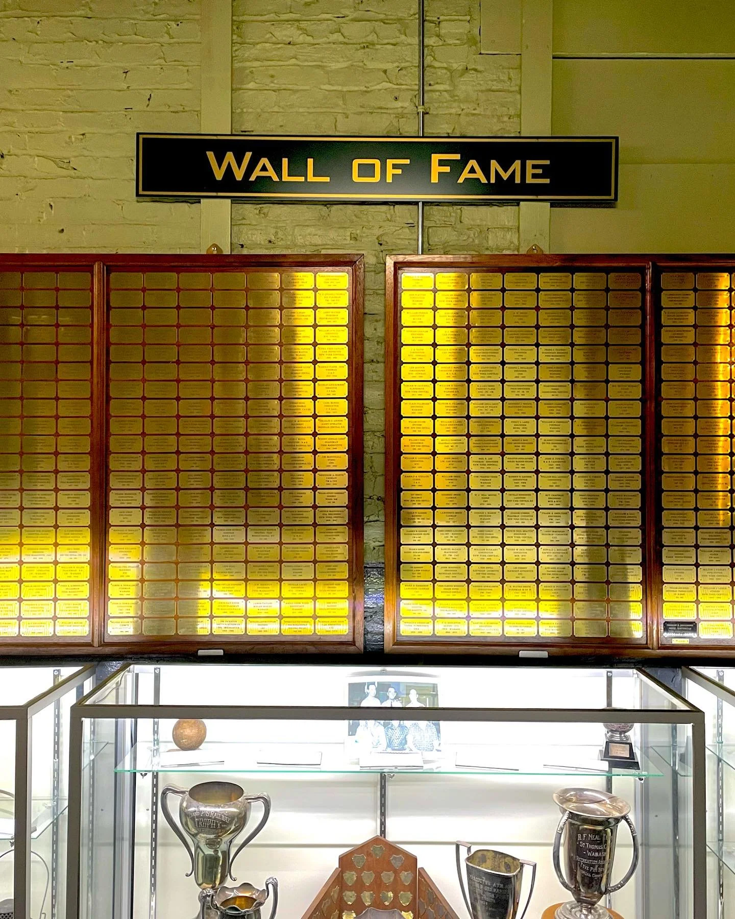 Wall of Fame gallery displaying railway worker plaques at Elgin County Railway Museum