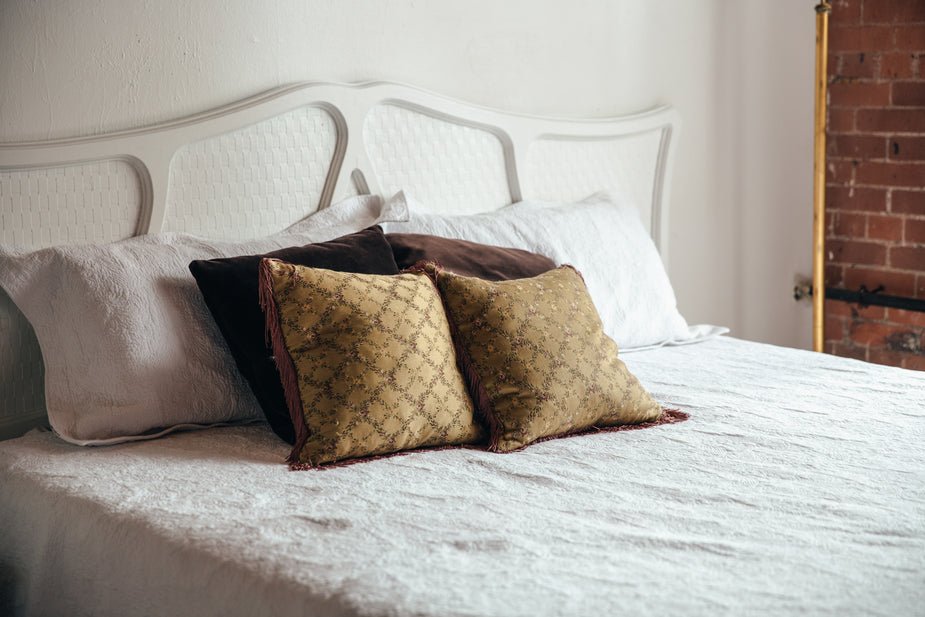 bedroom-bed-with-brown-throw-pillows_925x.jpg