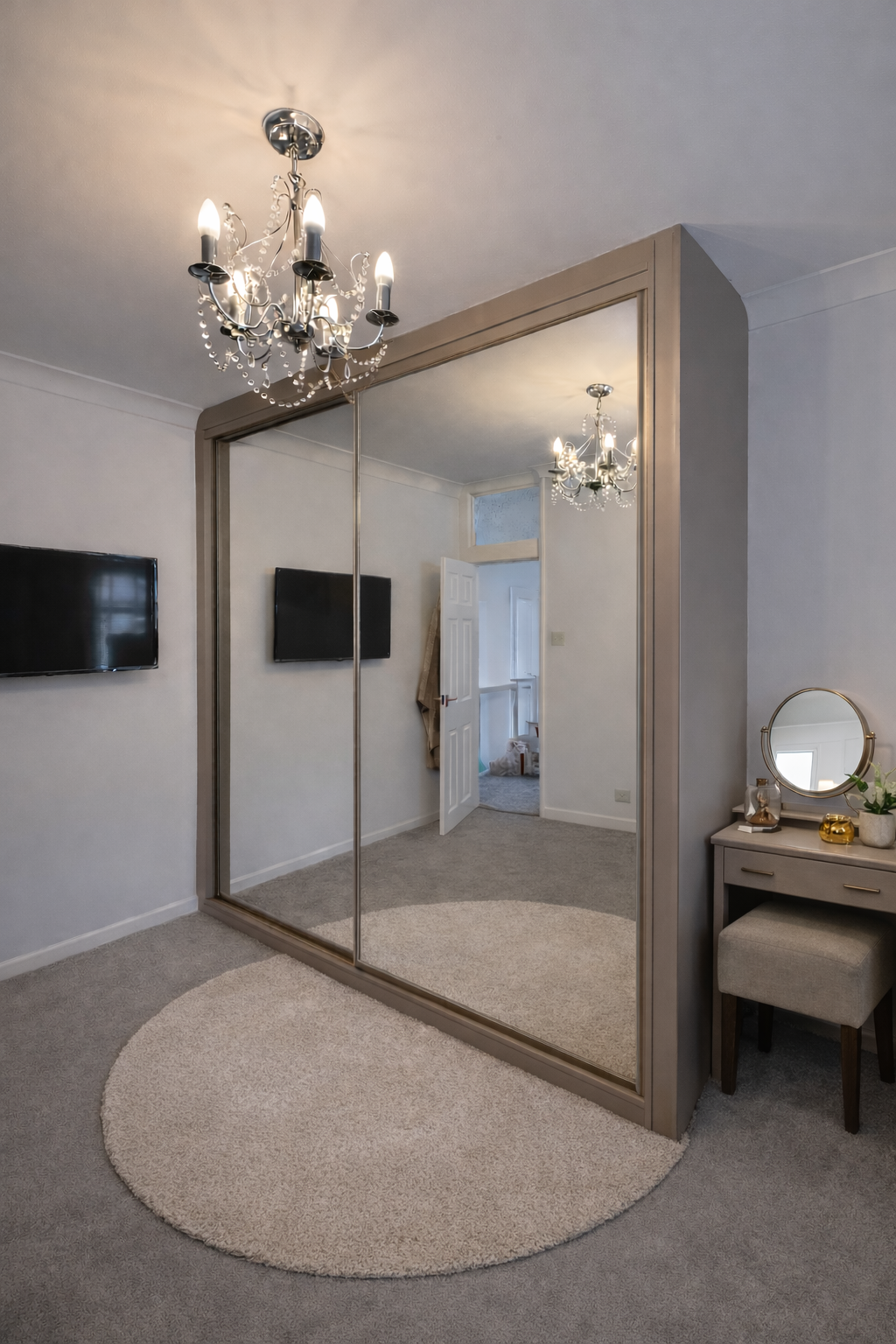 Stone Grey wood frame with matching stone profile handles.
Full-height mirrored doors fitted floor-to-ceiling in Pontypridd.

Made to measure in our Mountain Ash workshop - view our sliding wardrobes in Pontypridd.