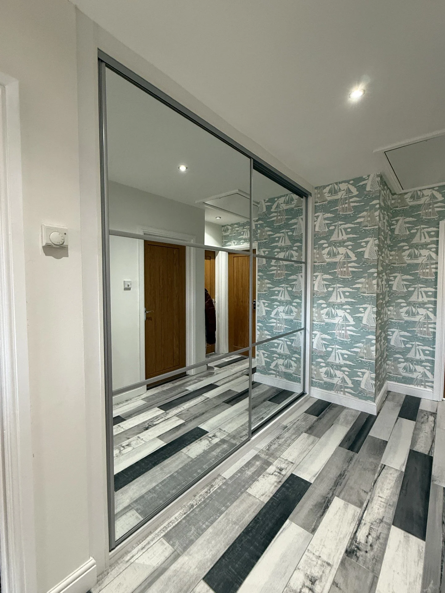 Hallway sliding wardrobe installation