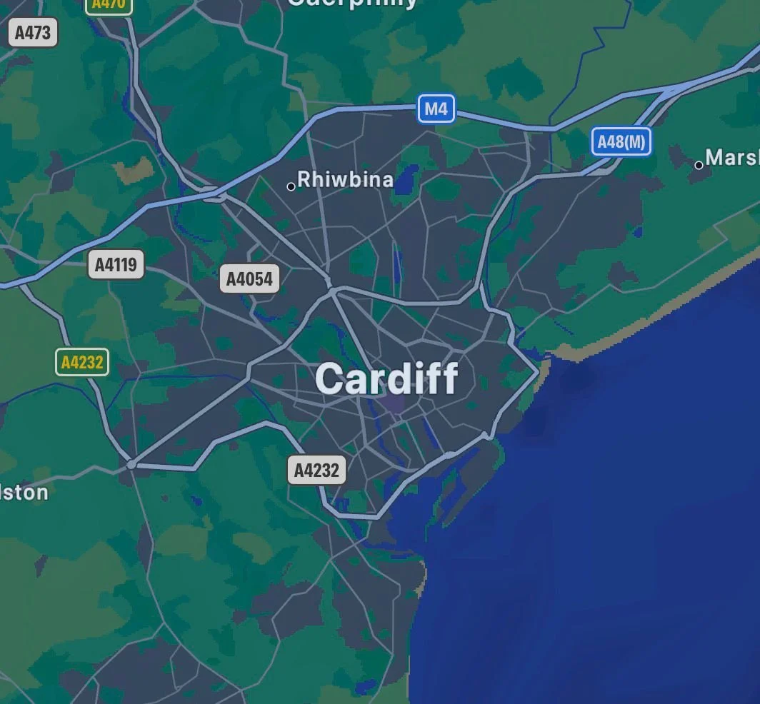Map showing Cardiff and Rhiwbina in Wales, with roads, highways, and surrounding areas, including the coastline.