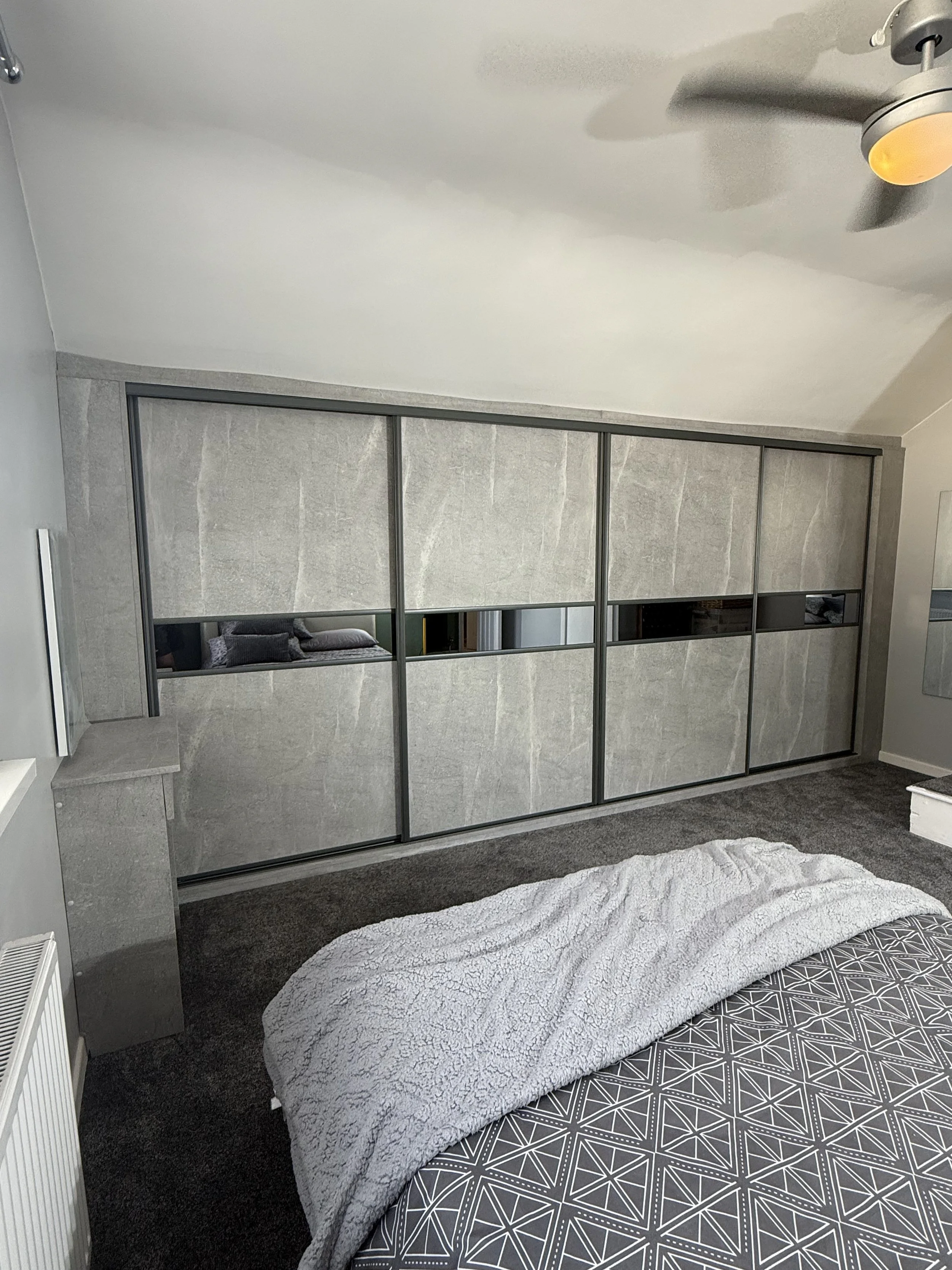 Fitted wood panel sliding wardrobe doors