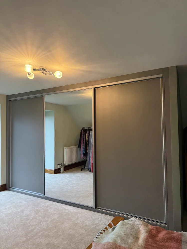 Internal layout of sliding wardrobe under sloping ceiling South Wales