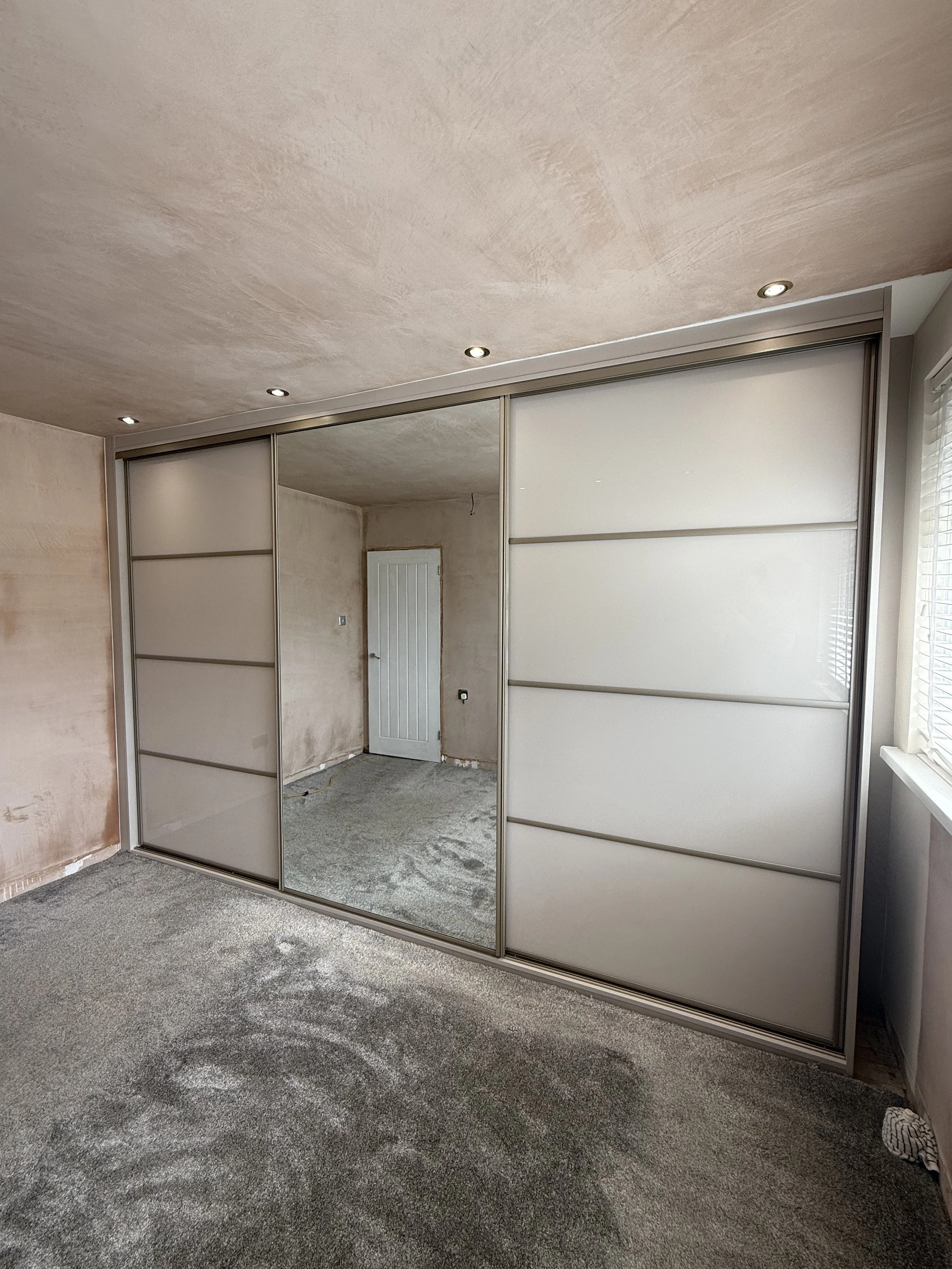 Gloss coloured glass sliding wardrobe door finish