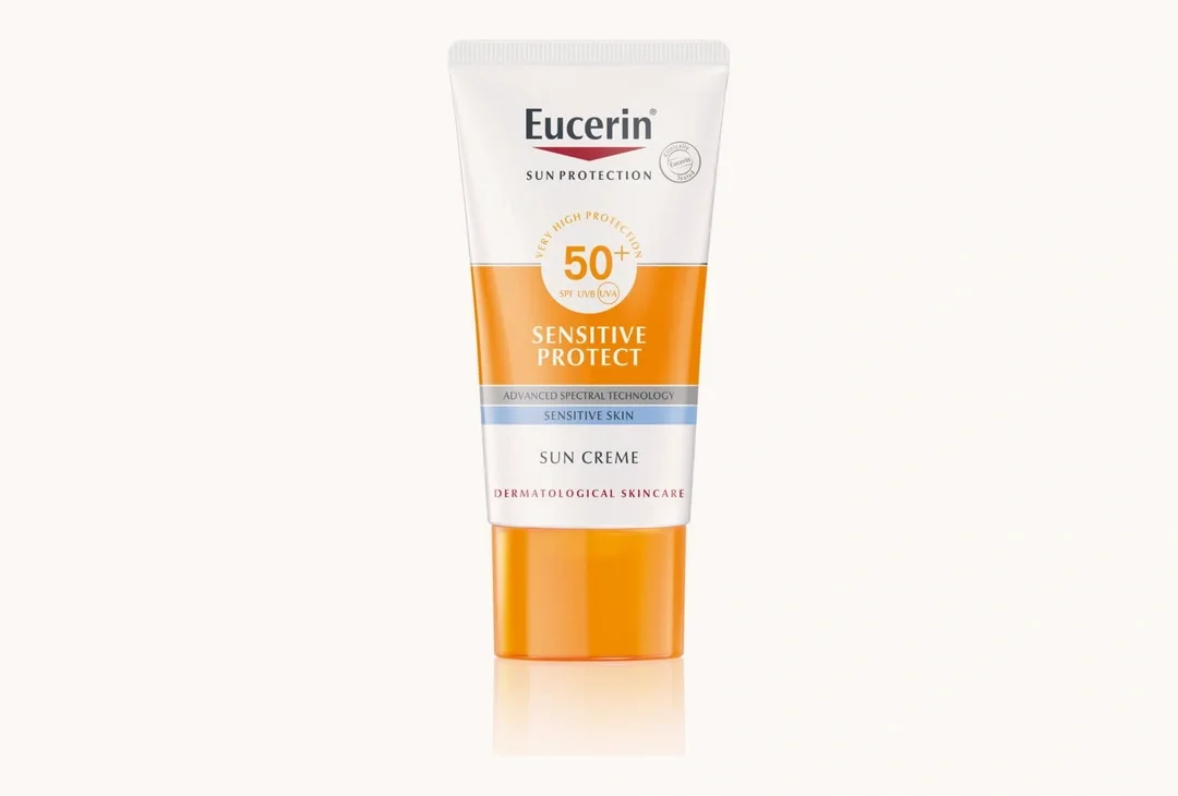 A tube of Eucerin Sensitive Protect Face Sun Cream marked SPF 50+, standing upright against a plain cream ground.
