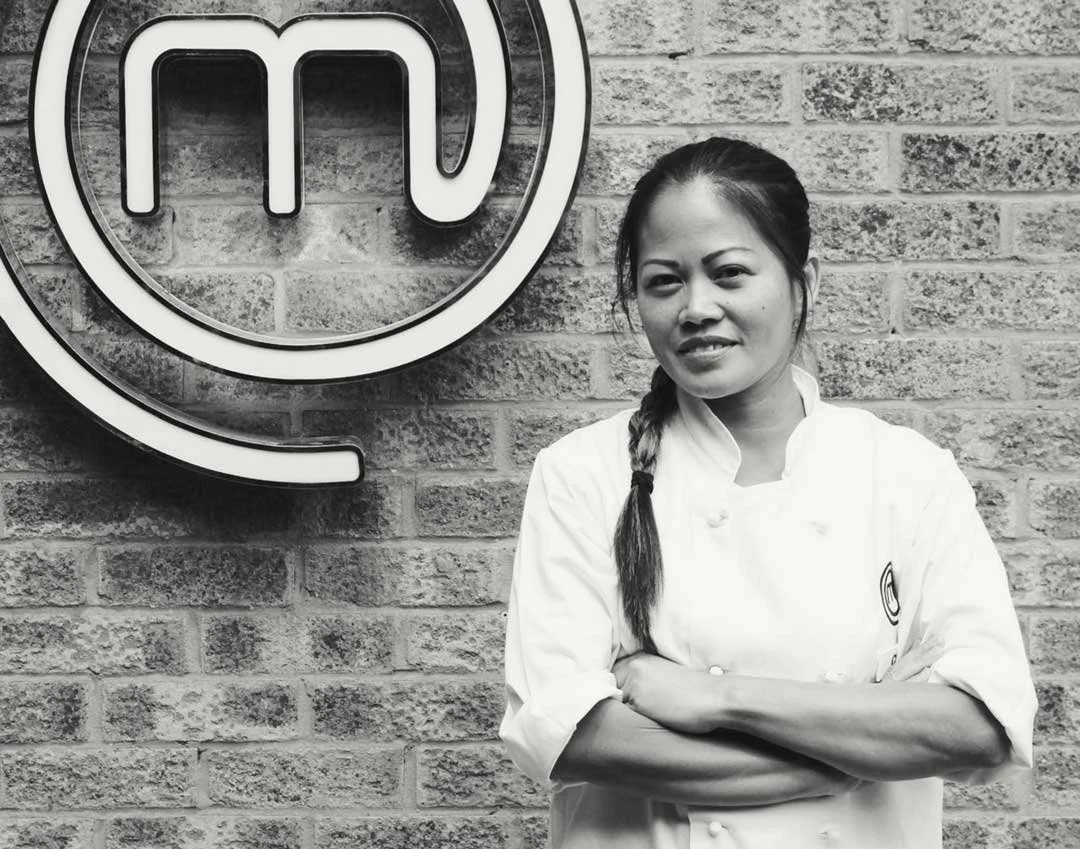 Award winning chef Cheryl Tio Blake is seen in front of the Masterchef logo.