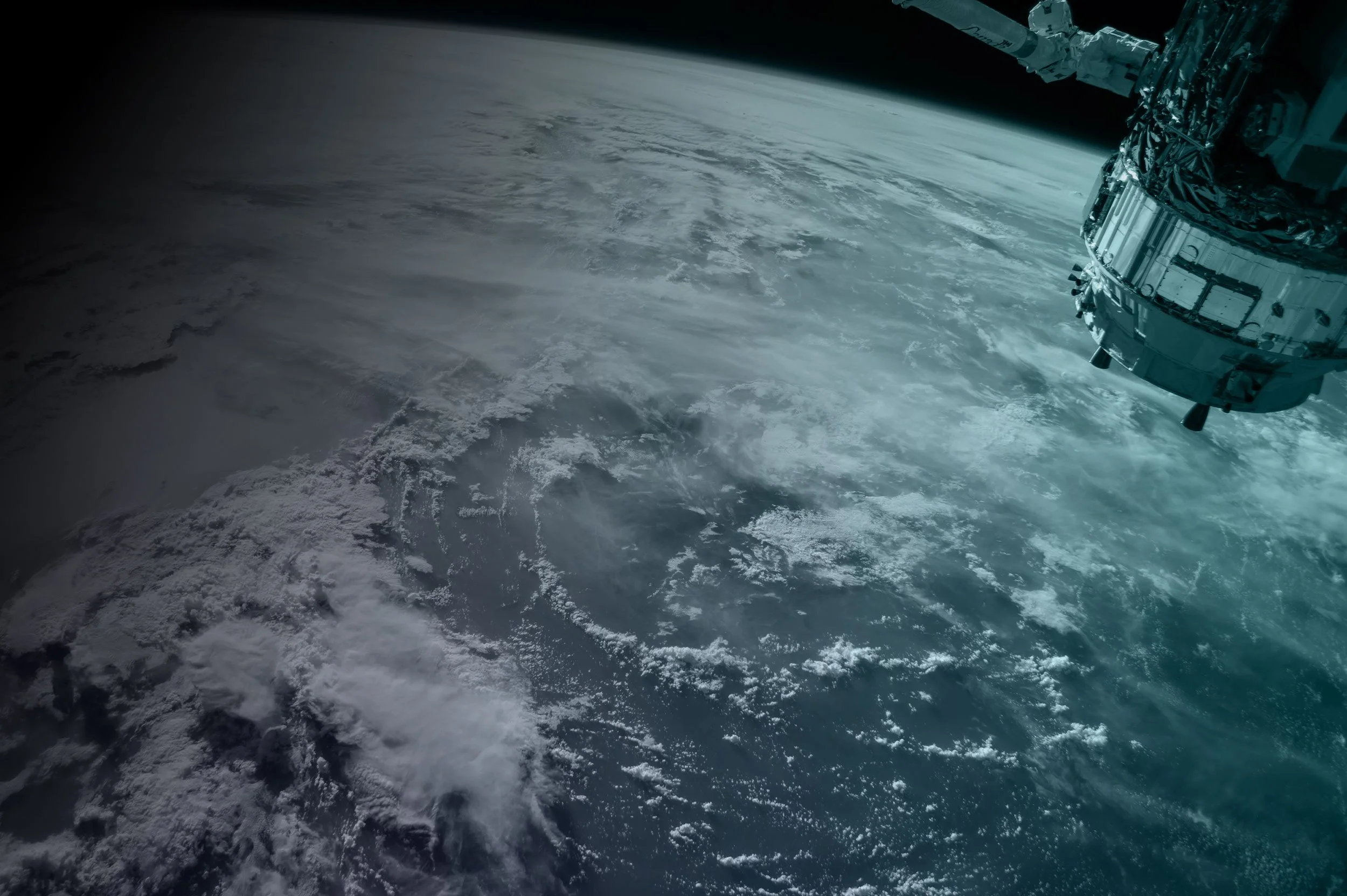 View of Earth from space with a spacecraft orbiting above the atmosphere.