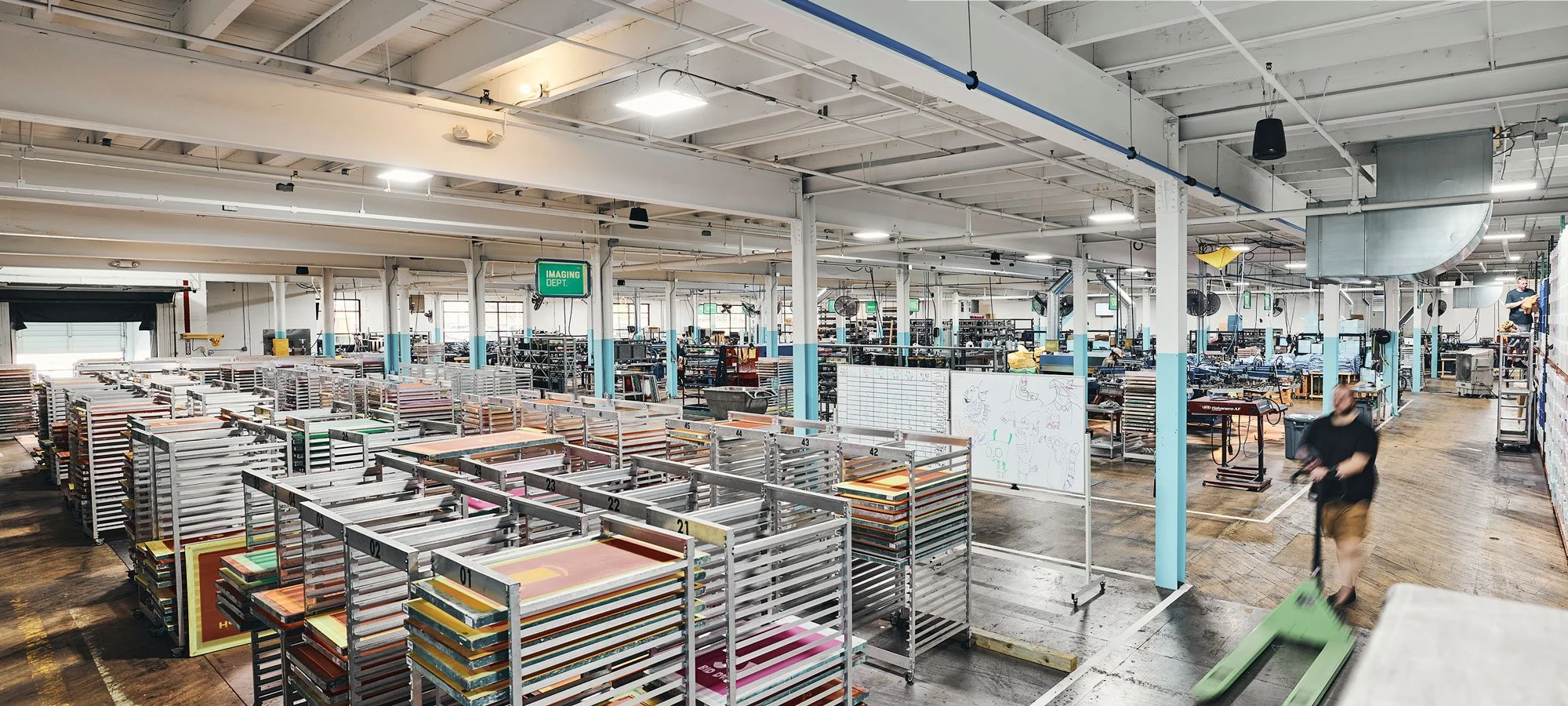A panoramic view of the production floor of utees, a custom apparel company in Cleveland, Ohio.