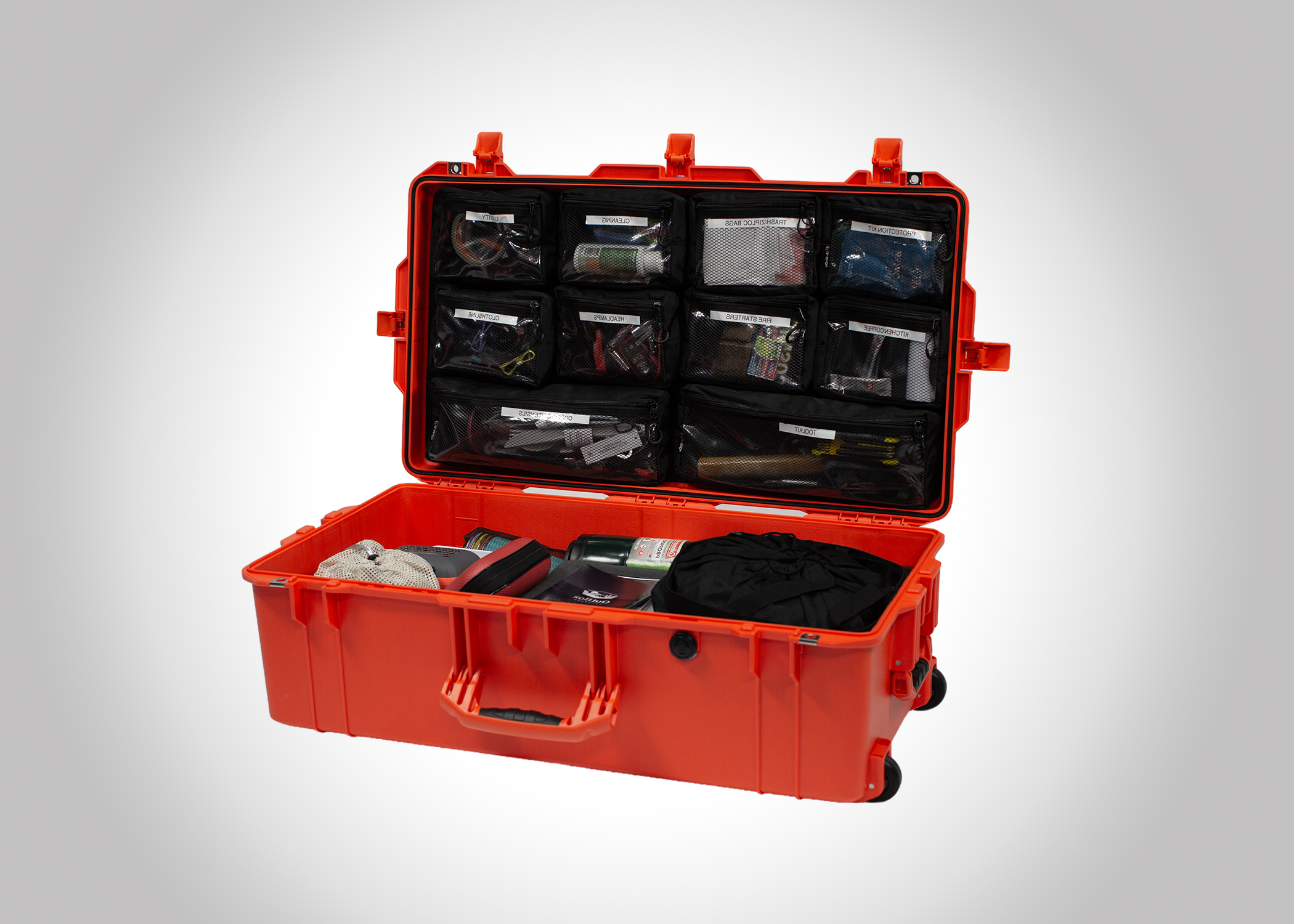 Open orange waterproof emergency first aid kit with organized contents and labeled compartments.