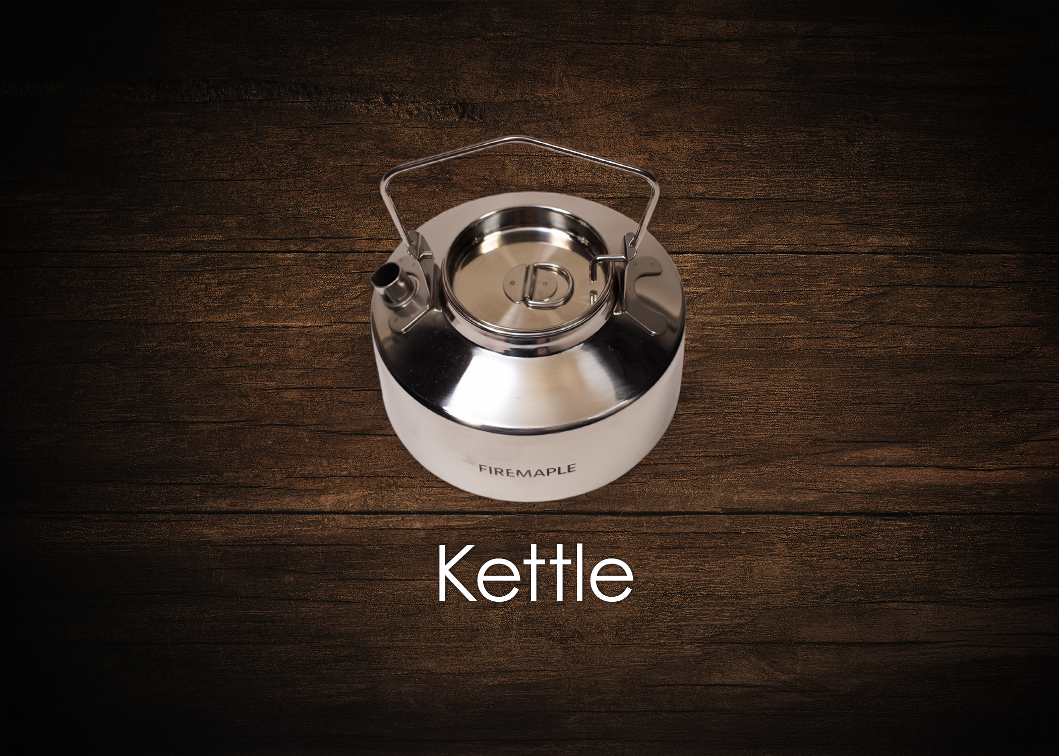A shiny metal kettle with a handle, spout, and lid, placed on a dark wooden surface with the word 'Kettle' written below.