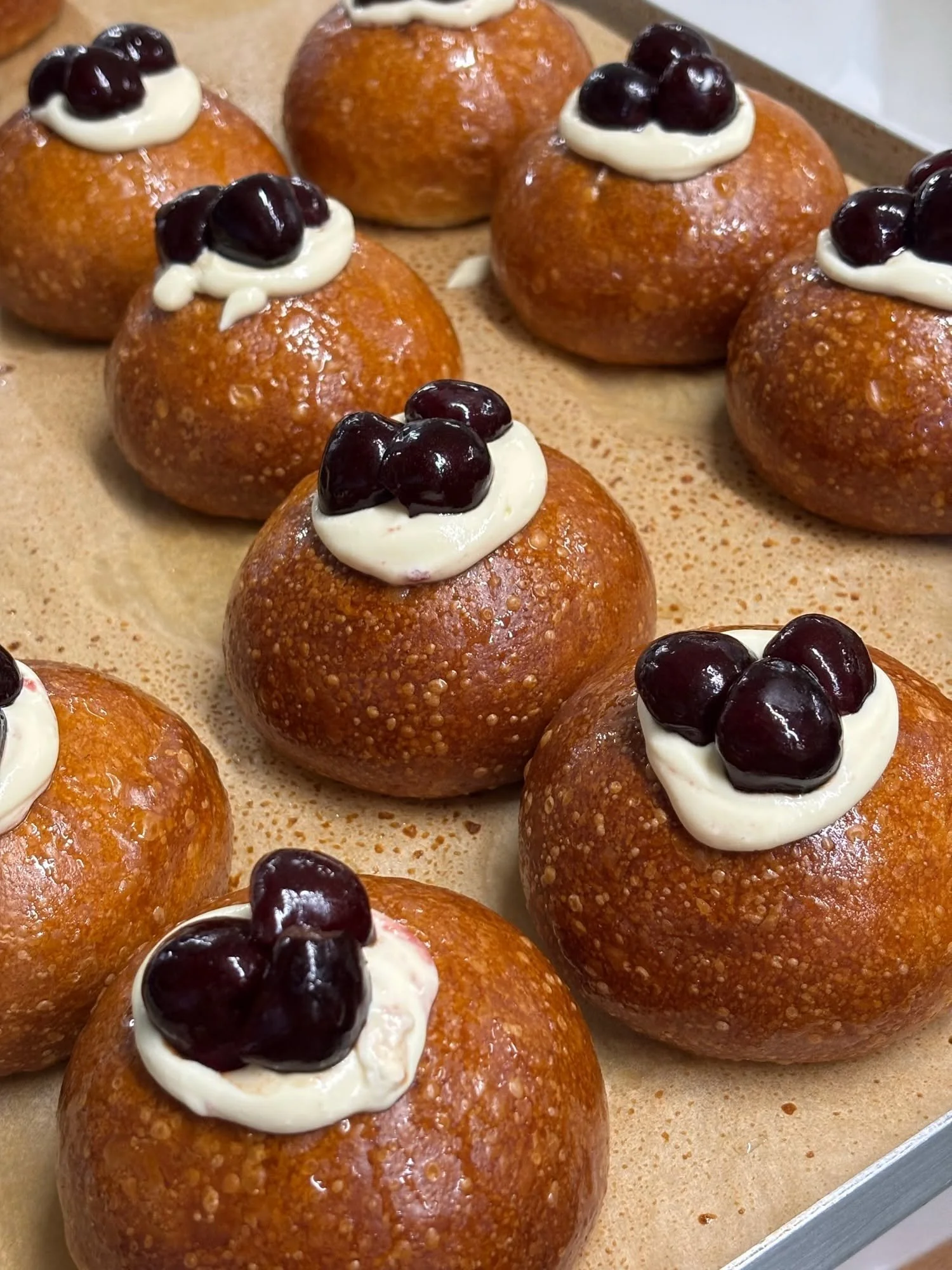cream filled buns with chocolate globes on top