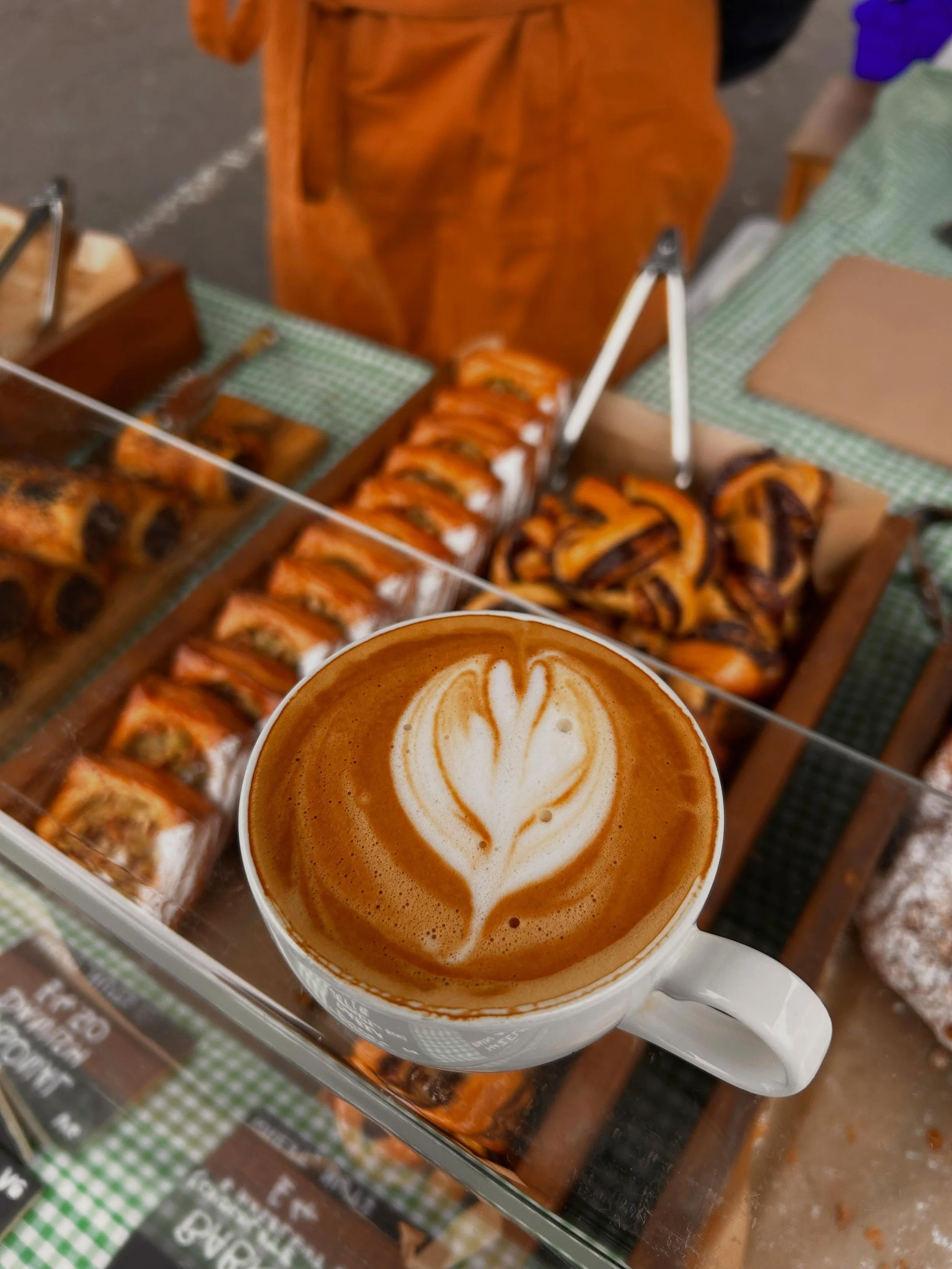Cup of coffee above pastries