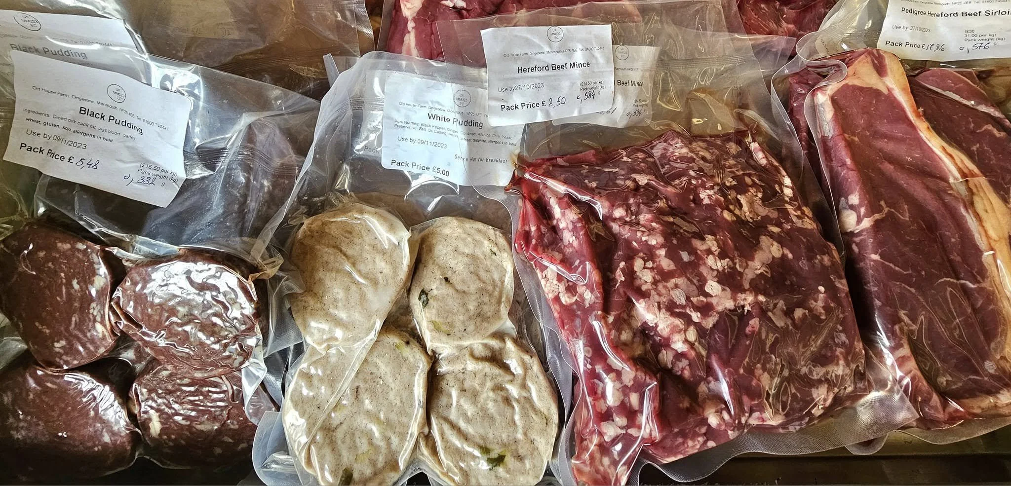 various uncooked meats in wraps