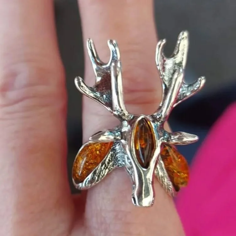 silver deer ring with orange gems