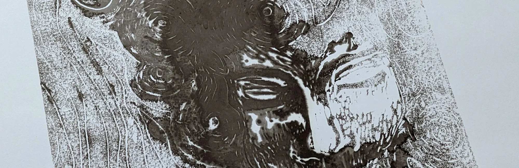 A black and white print or drawing of a child's face reflected on water, with ripples and textured background.