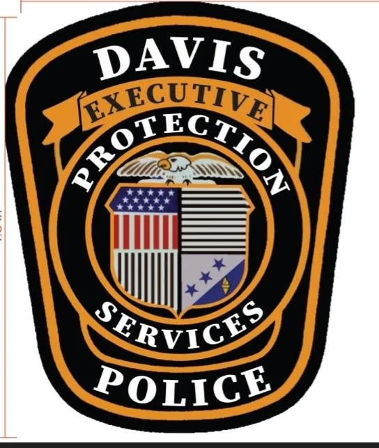 Badge for Davis Police with an eagle, American flag, and shield in the center, and text 'Davis Executive Protection Services Police' around the emblem.