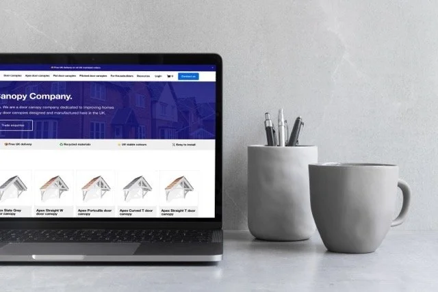 mockuuups-cropped-view-of-macbook-pro-mockup-on-the-gray-table Medium Large.jpeg