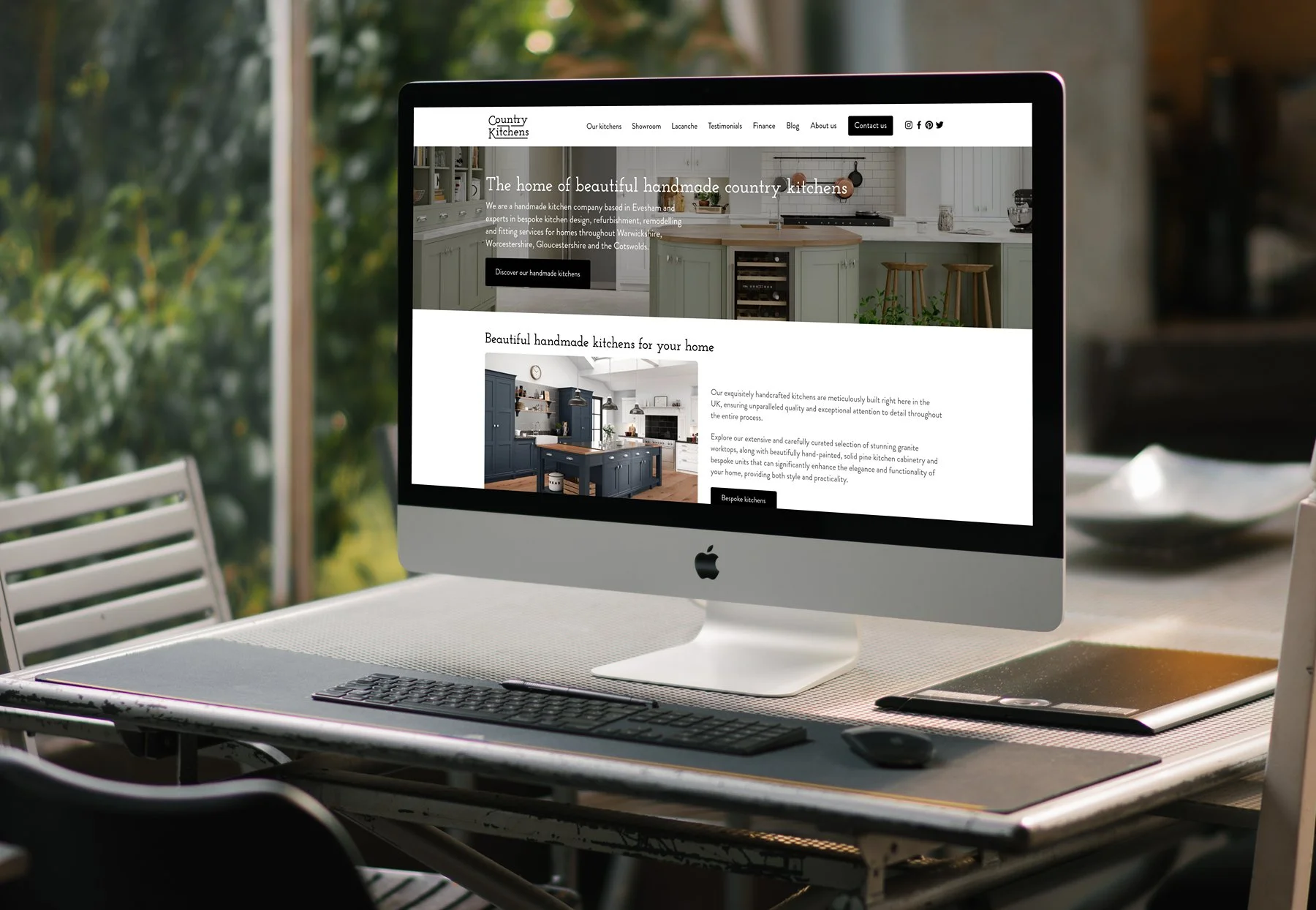 A computer screen displaying a website for custom kitchen designs, featuring images of modern kitchen interiors with cabinets and countertops.