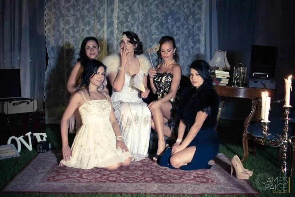 A vintage-themed bridal party or pre-wedding event with decor and styling by Rome-based wedding artist Cecilia Acquaroli, showcasing her ability to create unique and cohesive group looks.