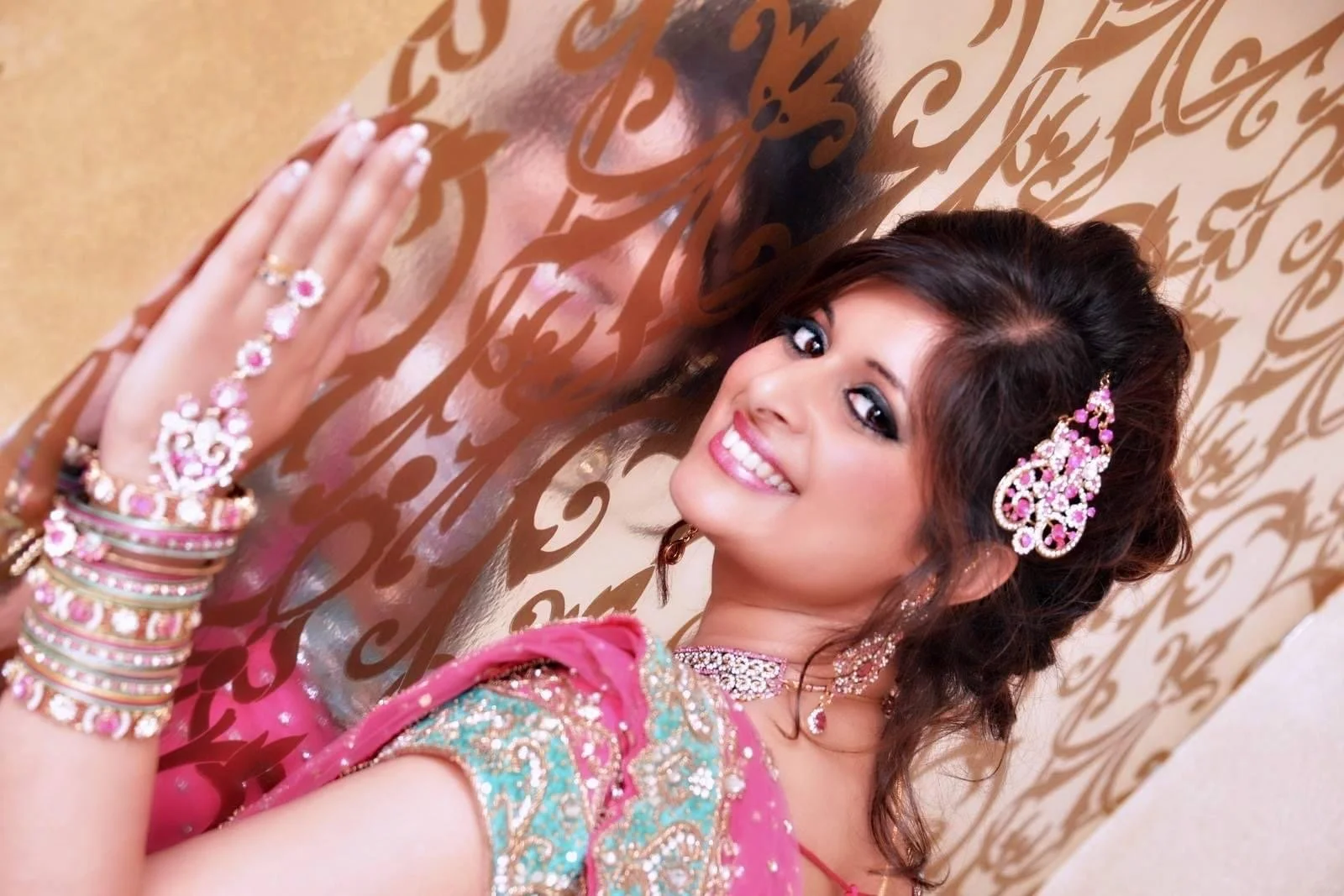 Sophisticated traditional wedding styling of an indian bride, with statement hair accessories and jewelry, expertly applied by international bridal artist Cecilia Acquaroli for a global celebration.