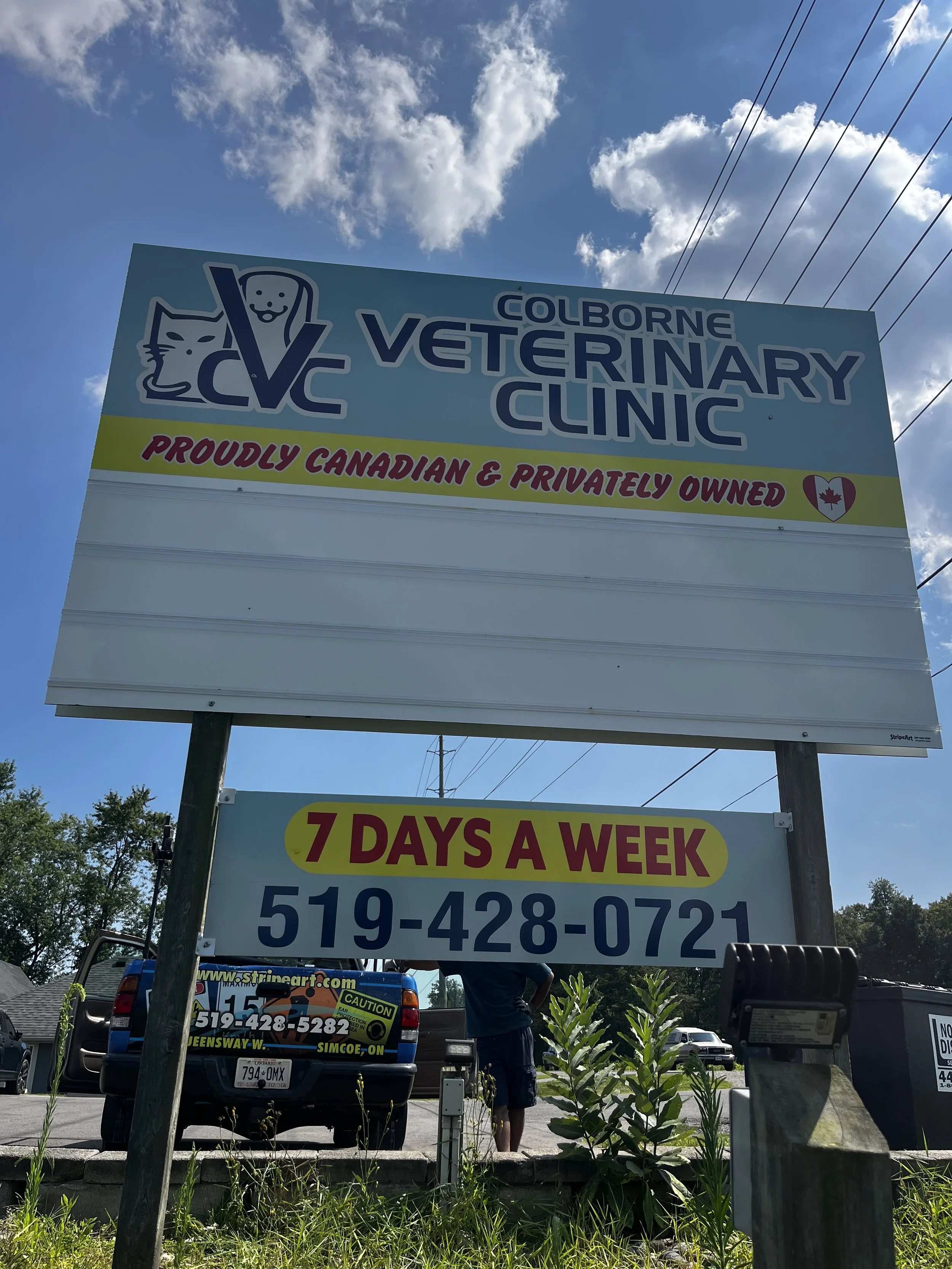 Sign for Colborne Veterinary Clinic, a Canadian-owned animal hospital, advertising services 7 days a week, with contact number 519-428-0721.