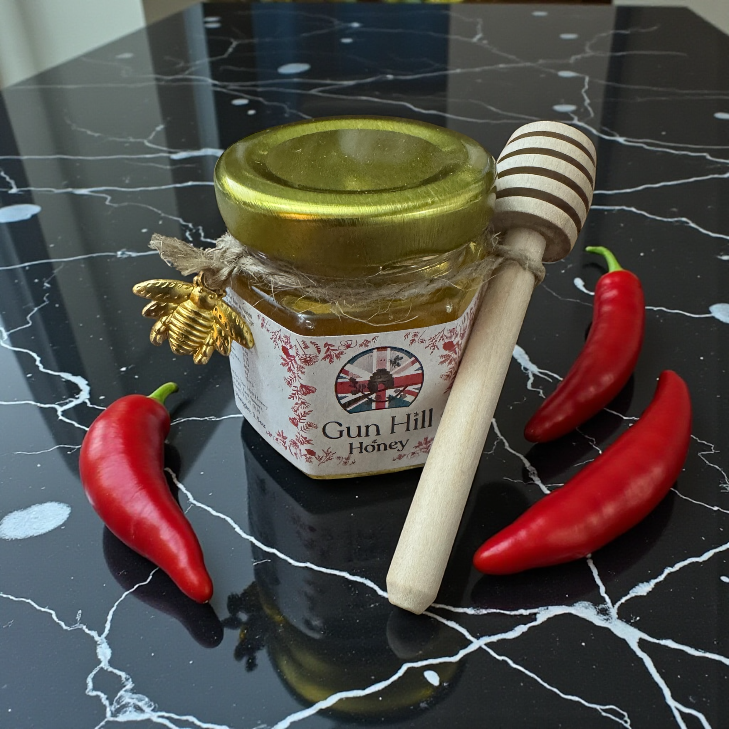 1.5oz Bottle supplied with drizzler and Golden Bee