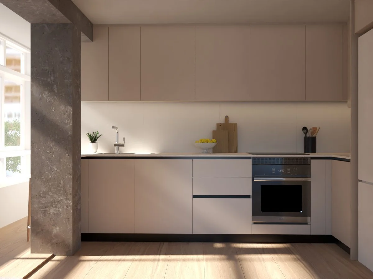 Modern kitchen with beige cabinets, countertop, a plant, cutting boards, a bowl of lemons, and an oven, illuminated by natural light.
