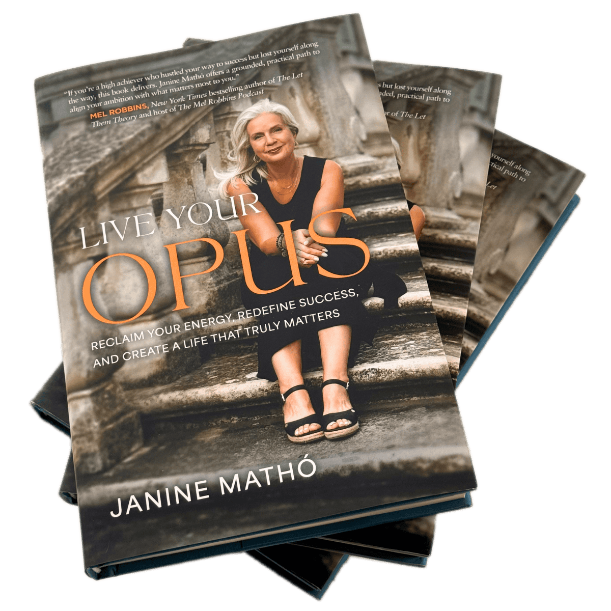 Book titled 'Live Your Opus' by Janine Matho, featuring a woman with gray hair in a black dress sitting on stone stairs.