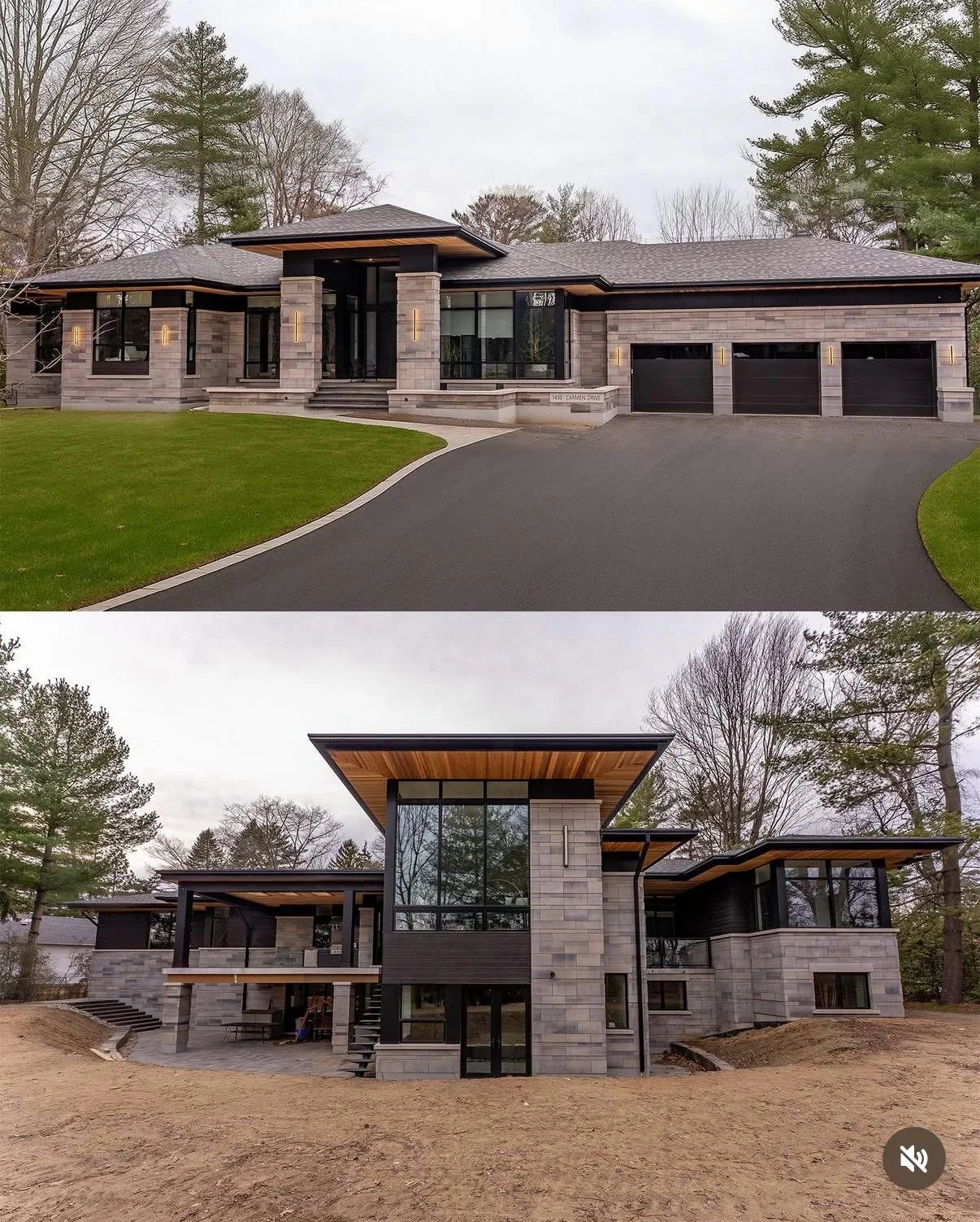 Front view of a modern house showing the exterior with large windows, a curved driveway, and a garage on the right. The house features a mix of stone and dark wood finishes, with a prominent entrance and steps leading up to it. The background has tre