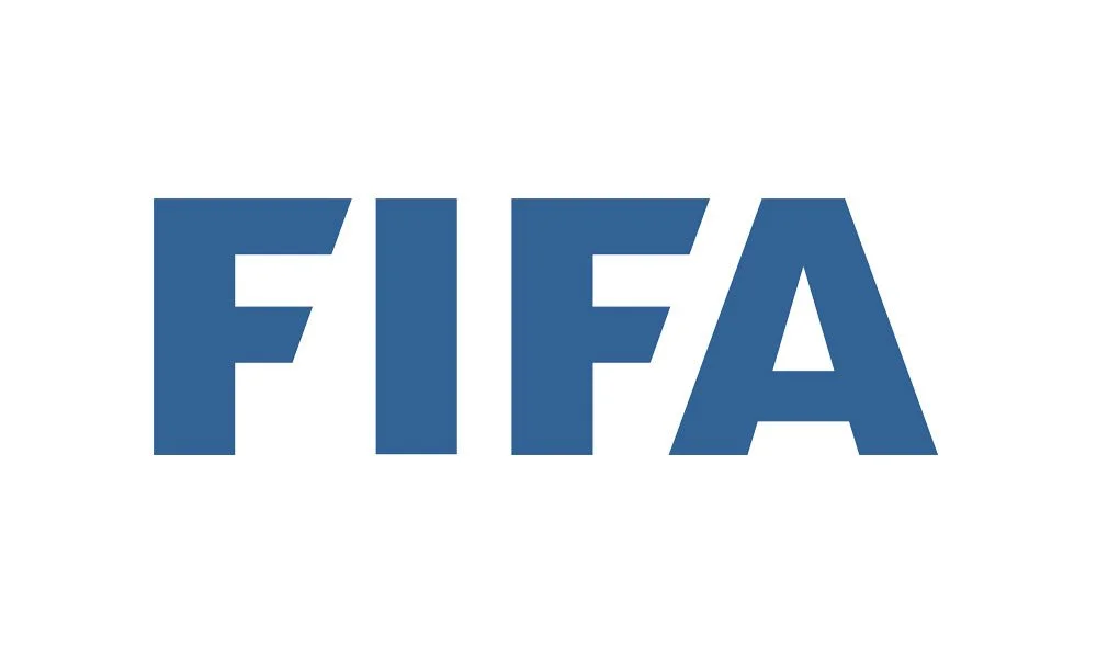 The image displays the logo of FIFA, the international governing body of soccer, with the acronym in bold blue letters on a white background.