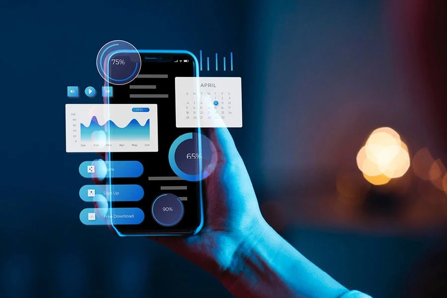 A person holding a smartphone with a futuristic digital interface displaying charts, a calendar, and data analytics in blue tones.