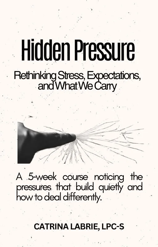 Book cover titled 'Hidden Pressure: Rethinking Stress, Expectations, and What We Carry' by Catrina Labrie, LPC-S. The cover features a hand with cracks emanating from the finger, symbolizing hidden stress.