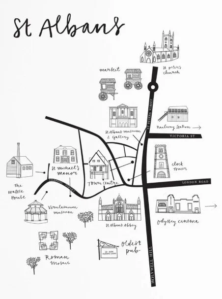 A hand-drawn map of St. Albans, highlighting landmarks like the market, 1st person's church, the Roman museum, Verulamium museum, St. Michael's manor, town centre, old pub, cathedral arcade, clock tower, and the waffle house, with streets Victoria Street, London Road, and Holywell Hill.