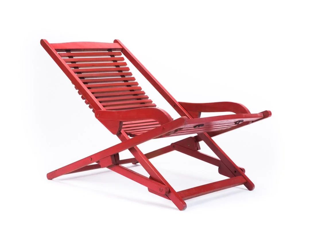 Red wooden lounge chair on a white background.