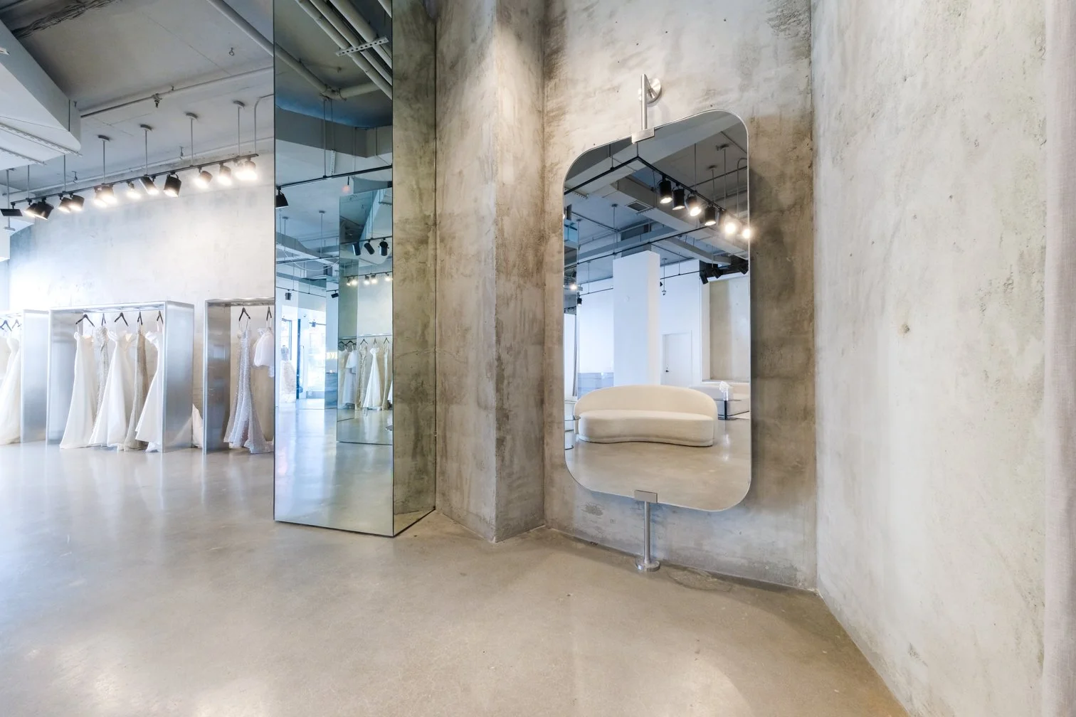 kyha bridal flagship showroom new york concrete mirrored retail interior