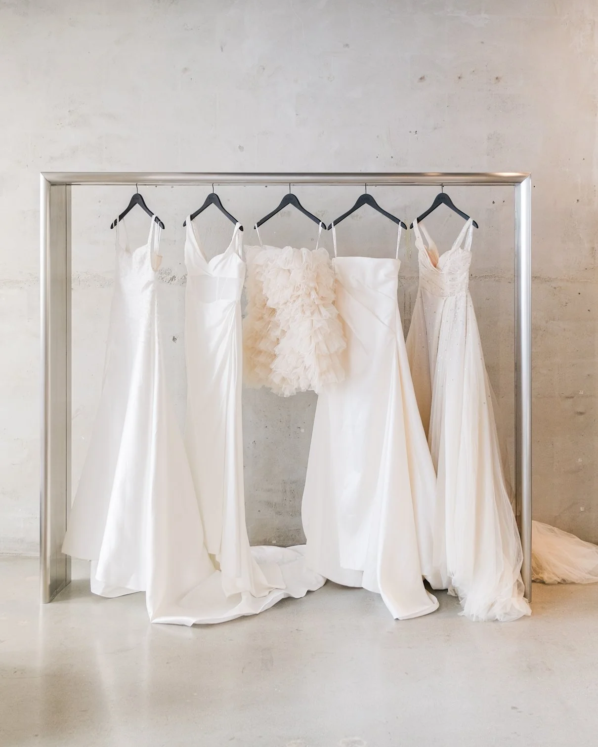 kyha bridal flagship showroom new york brushed metal garment rack