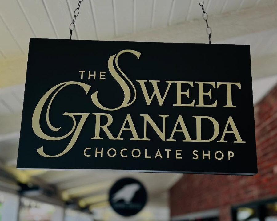 Sign for The Sweet Granada Chocolate Shop hanging from the ceiling