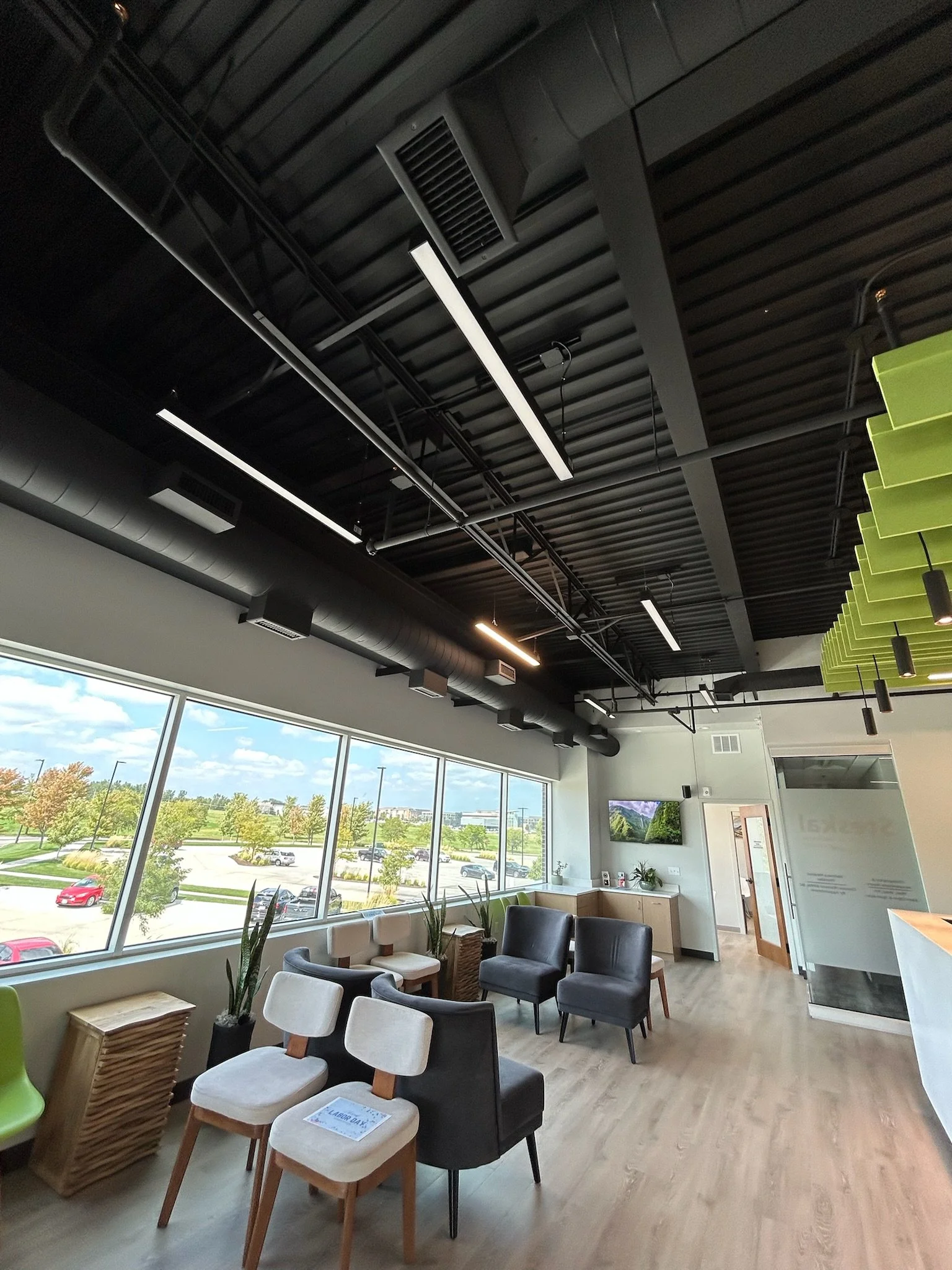 Freshly painted commercial lobby with neutral walls and bright natural lighting