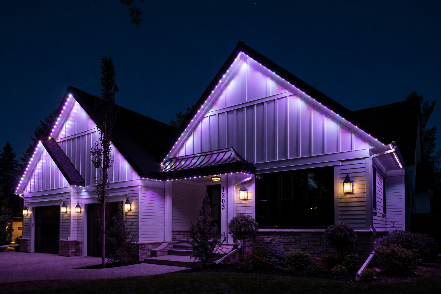 Illuminated home and landscaped driveway.png
