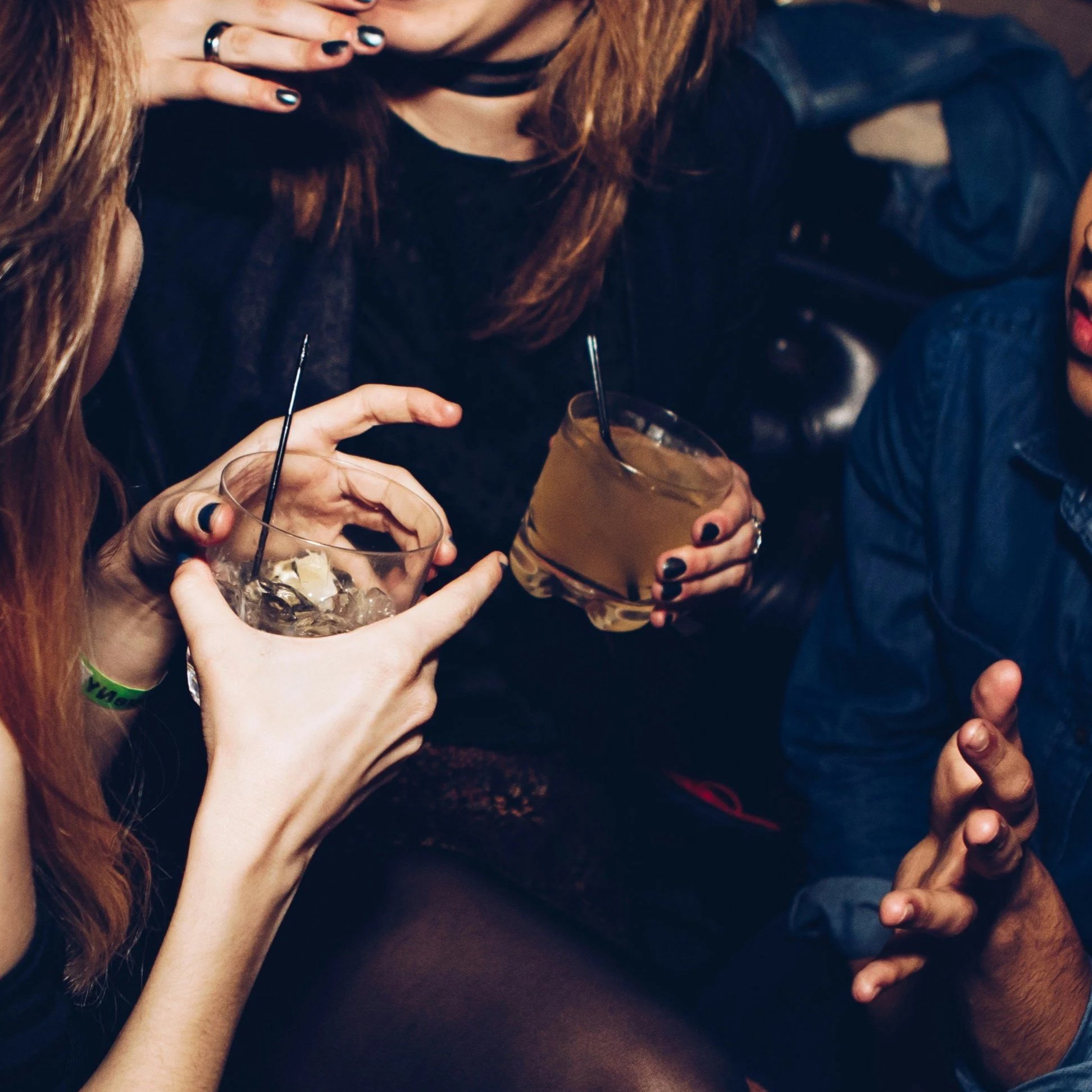 Guests with cocktails on the dance floor at The Wiggle Room late-night party