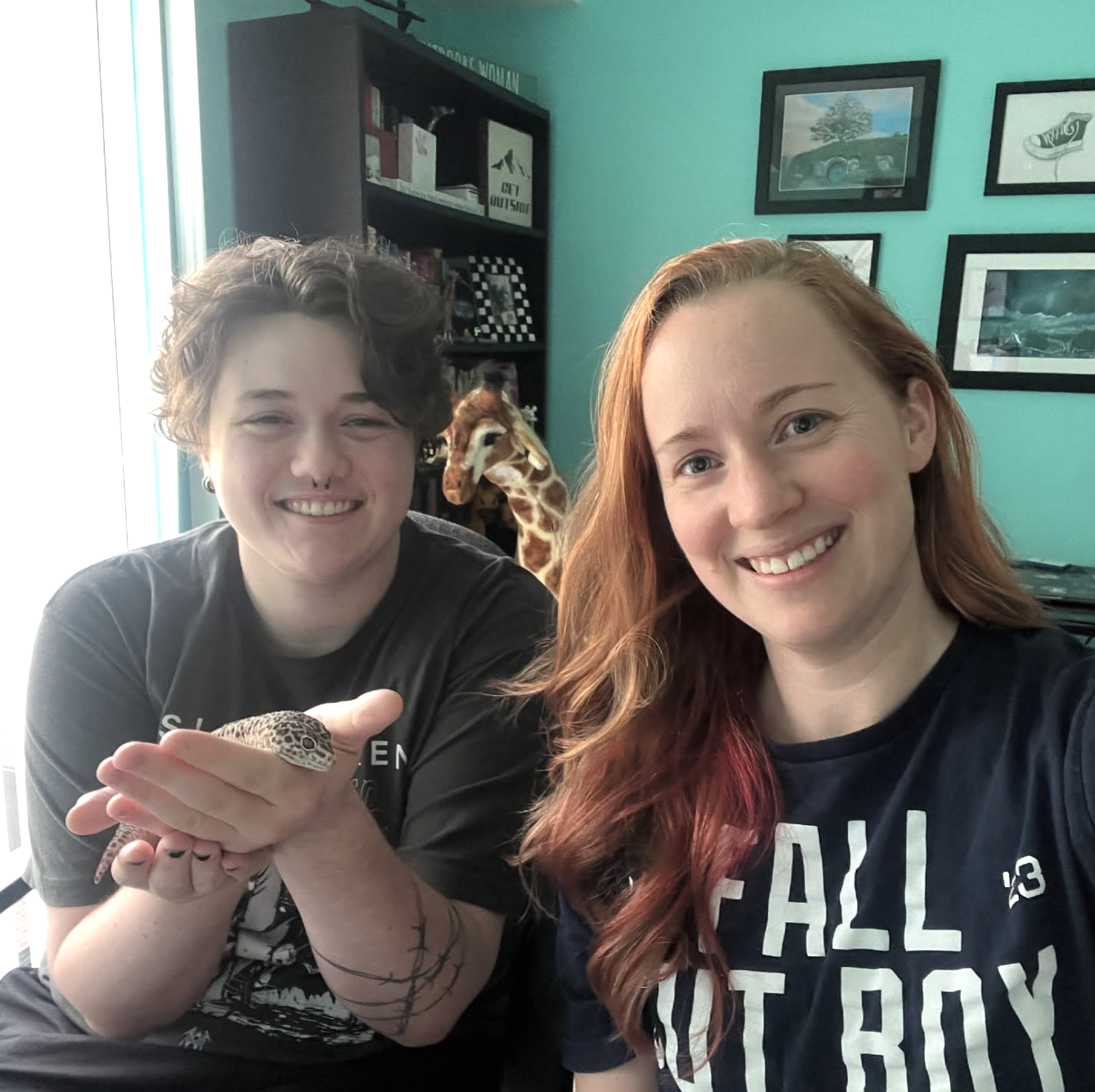 Kristen with intern Griffin holding her pet gecko