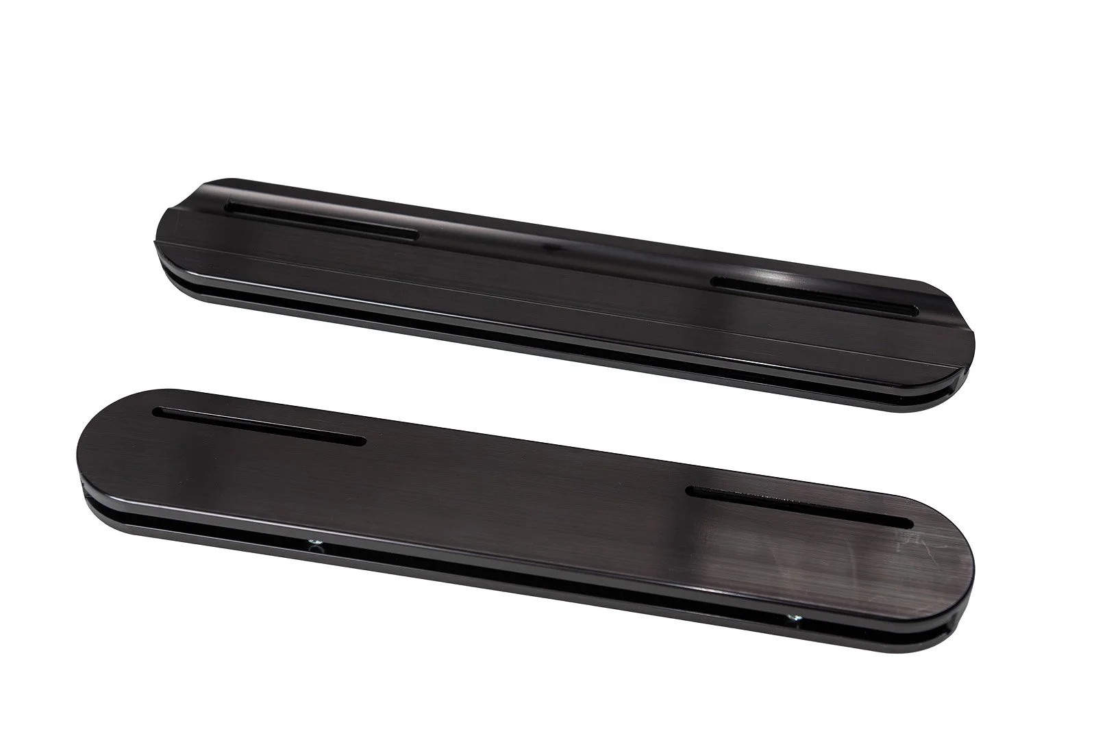 Two black door lock switches with a sleek design, placed on a white background.