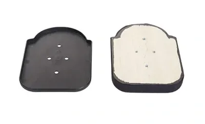 Two halves of a camera film canister with one side open, showing the inside of the container.