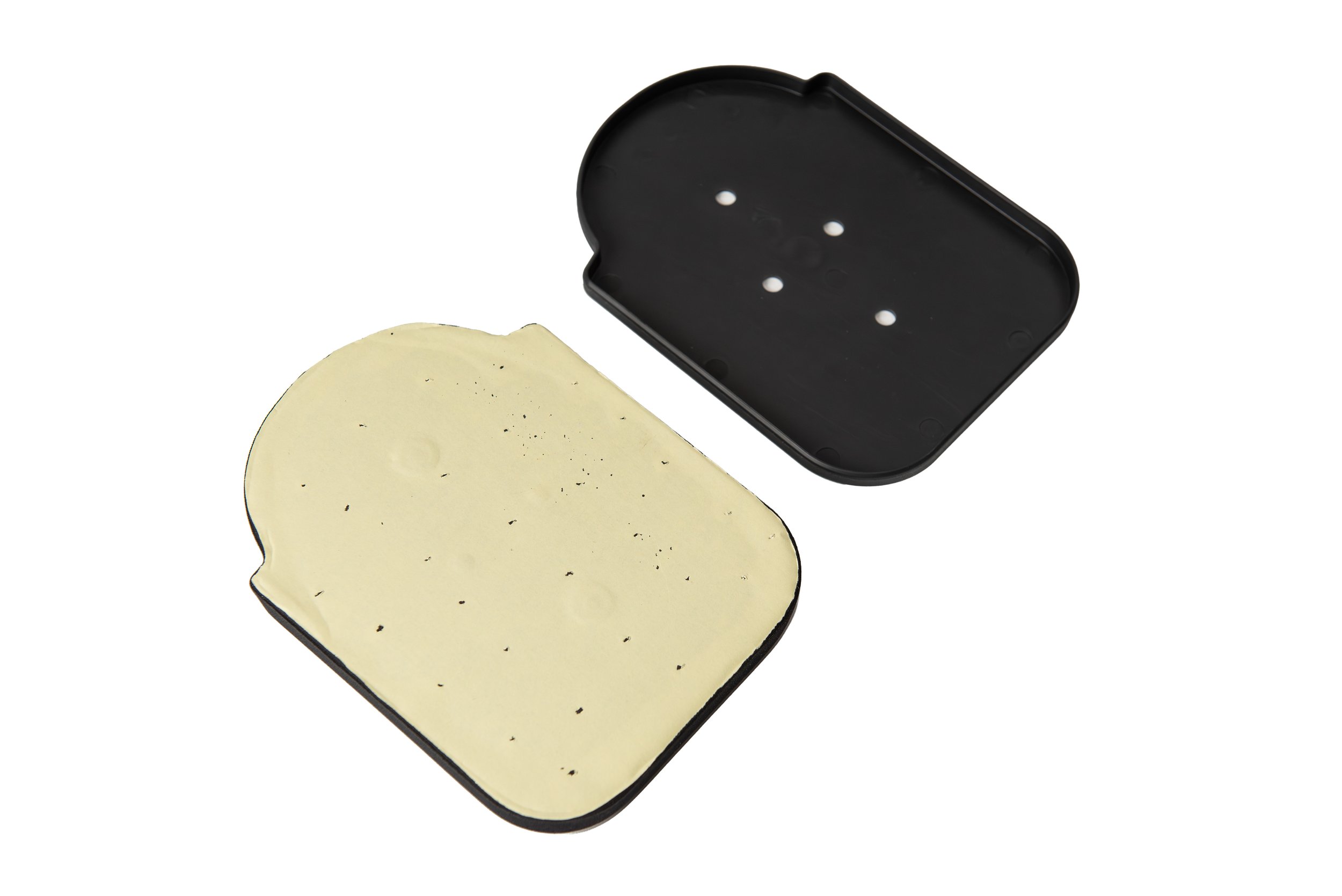 A black plastic container with a lid, separated from the lid showing the inside with cheese.