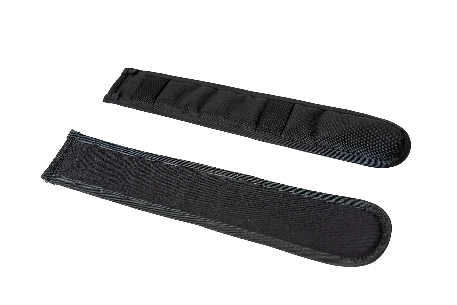 Two black rifle buttstock cheek risers and pads with hook-and-loop closures.