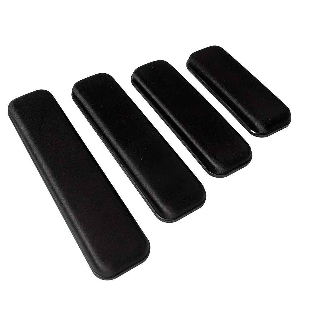 Set of four black piano keys, smallest to largest, on a plain white background