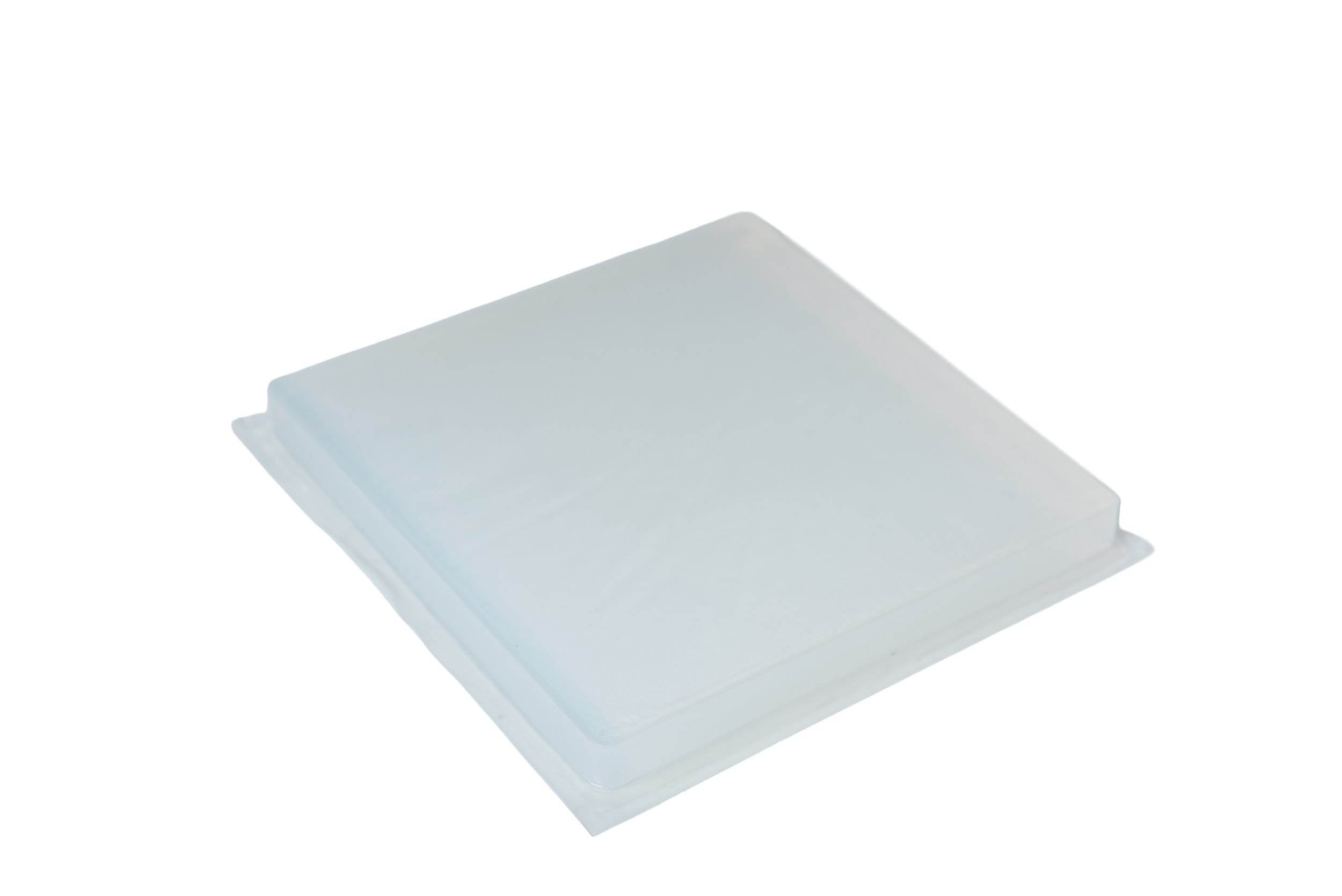 Stack of transparent plastic containers or sheets.
