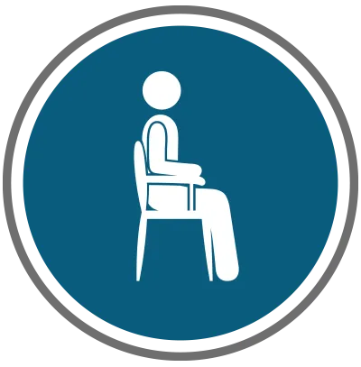 A person sitting on a chair in a circular sign with a blue background.