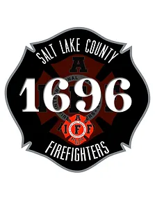 A black shield-shaped emblem with "Salt Lake County Firefighters" written around the edge. The number "1696" is prominent in the center over a red cross-like design with "IAFF" initials.